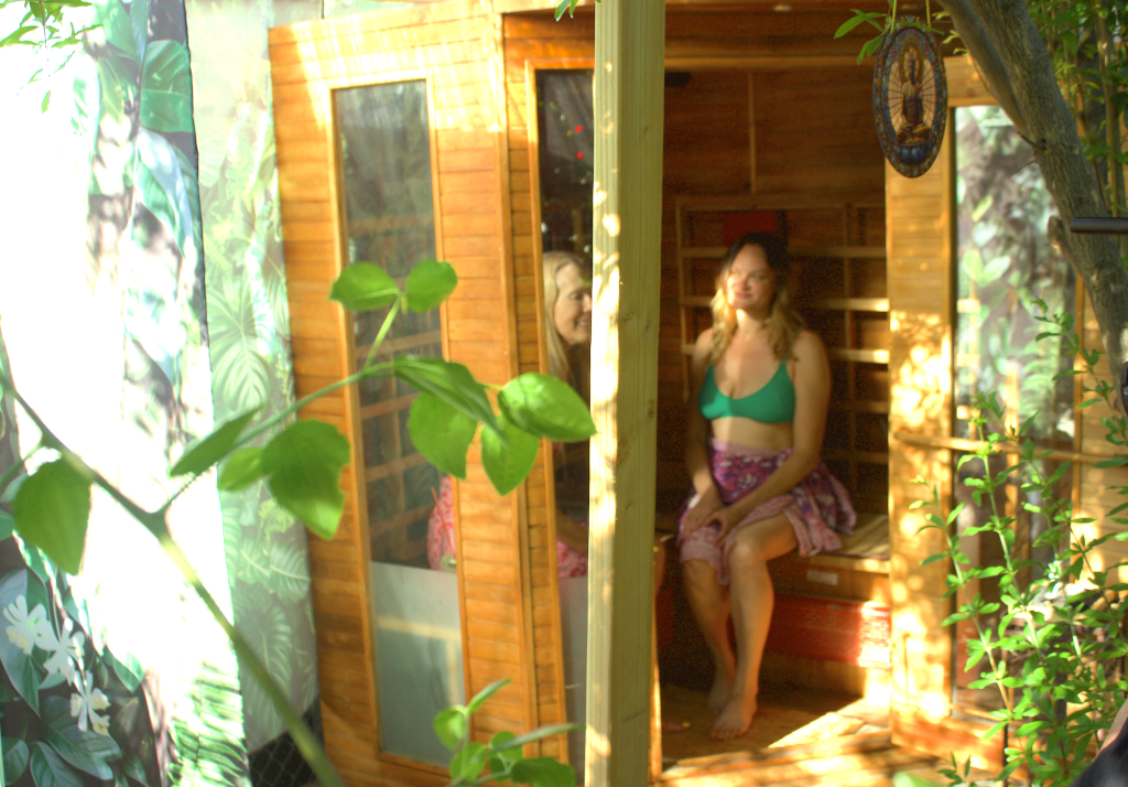 Duo Micro Retreats two ladies in the infrared sauna which is in the orchard zone